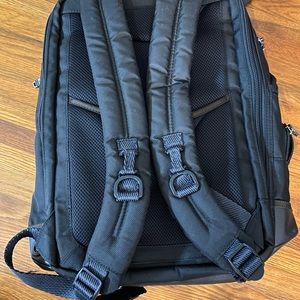Tumi laptop book bag.